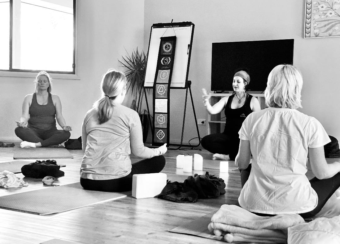 325432000_1207178836581851_6304405610087515806_n a group of women doing meditation